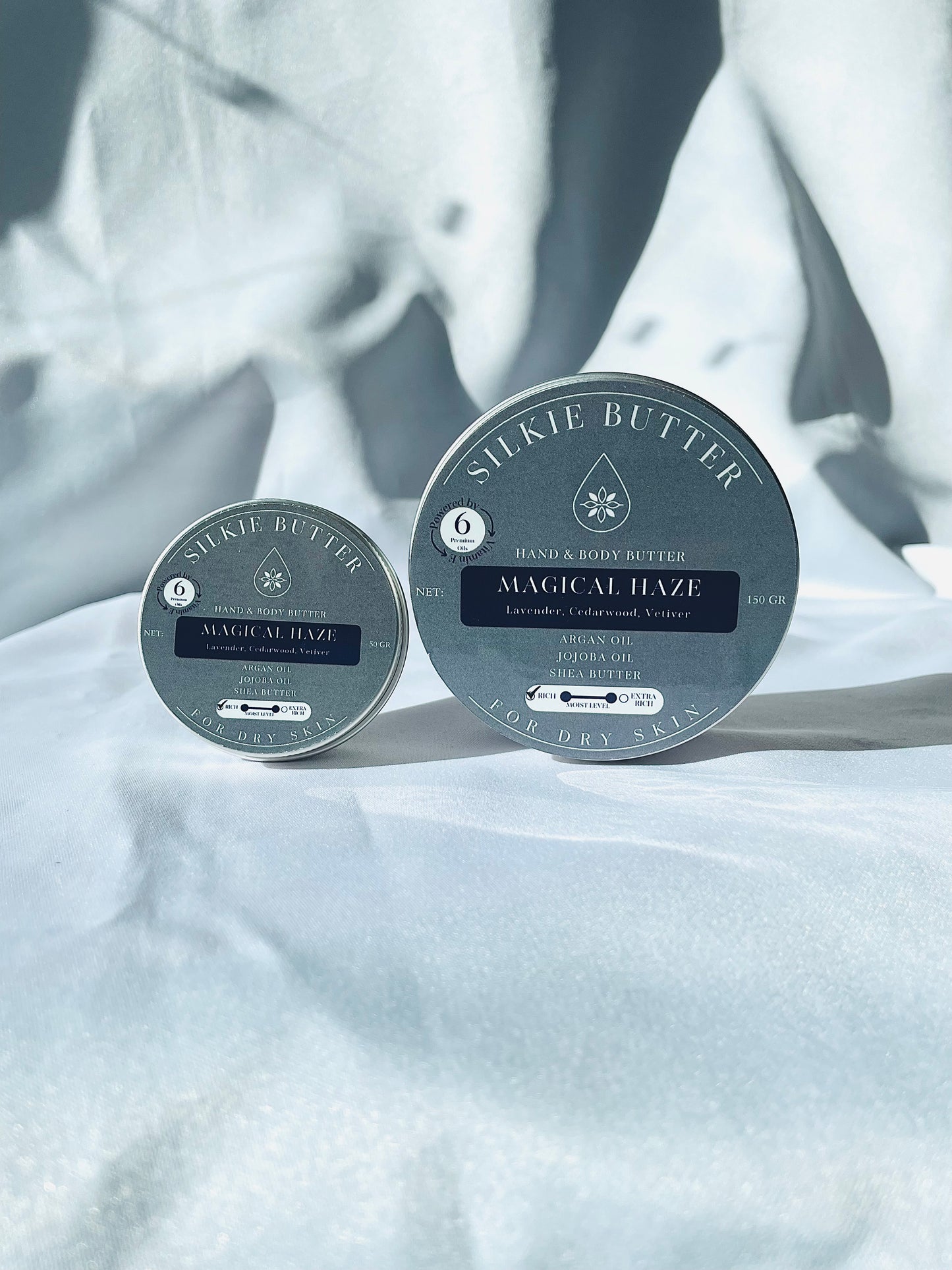 Two containers of Silkie Butter 'Magical Haze' for dry skin