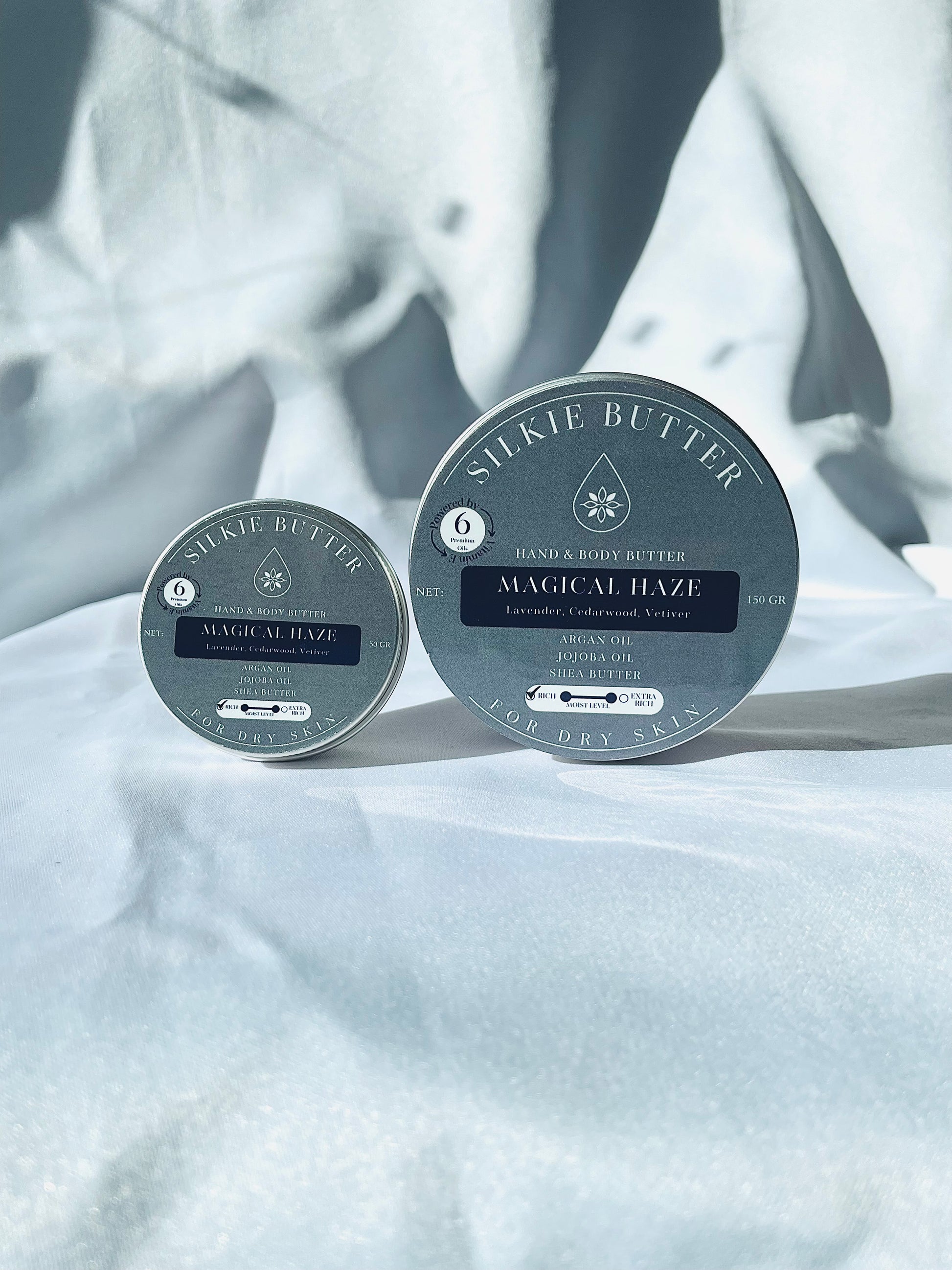 Two containers of Silkie Butter 'Magical Haze' for dry skin